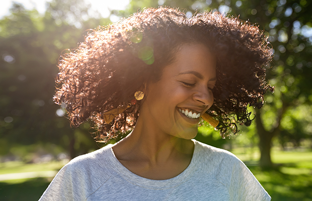 Woman standing in sunshine