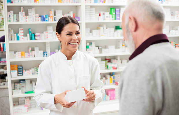 Pharmacist serving a customer