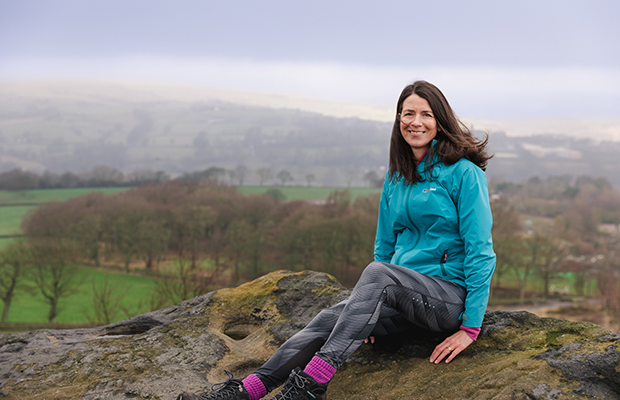 Elizabeth sitting on hillside