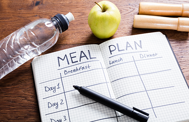 Note book with a meal plan table