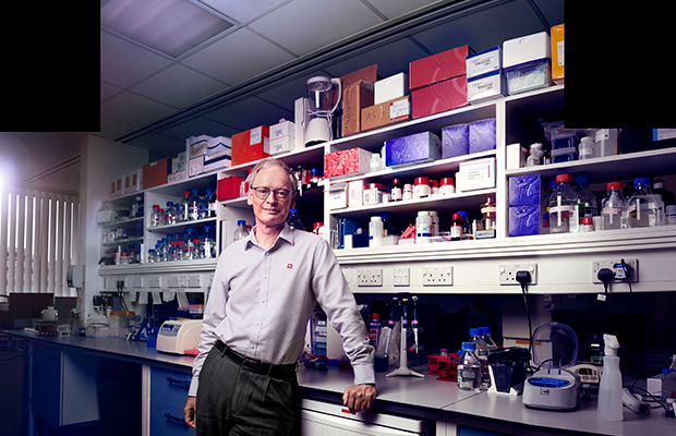 Hugh standing in research lab