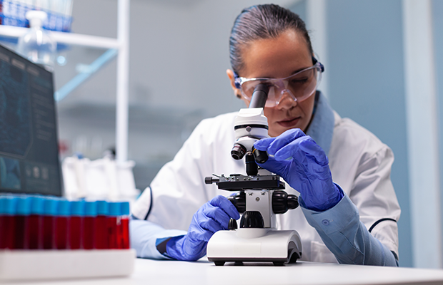 Medical professional with microscope