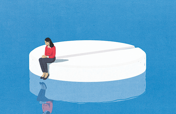 Illustration of a woman sitting on a large pill