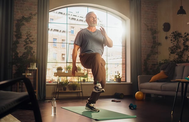 A person doing high knees exercise at home