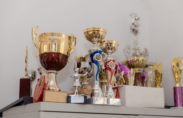Katharine's dancing trophies sit atop a chest of drawers.