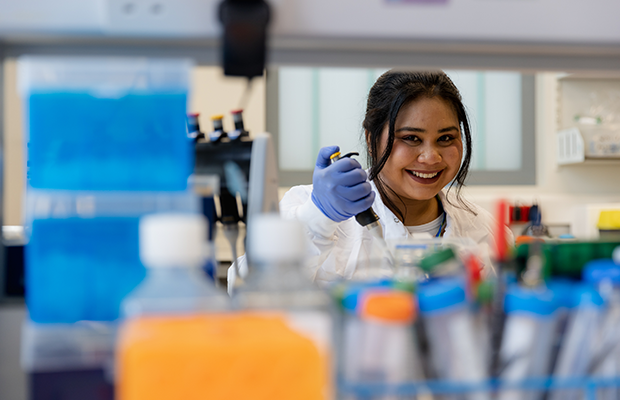 Photo of Syabira working in the lab