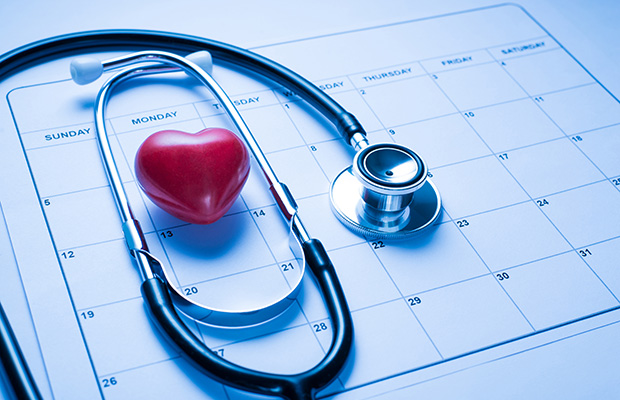 Stethoscope lying on top of a calendar