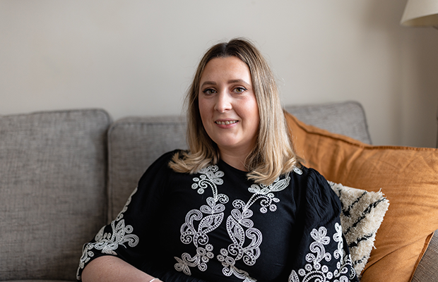 Rhiannon Baxter sitting on the sofa