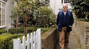 Laurence Humphreys-Davies walks down his garden path.