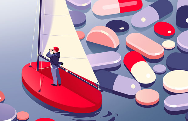 man on a boat navigating the way through water filled with tablets