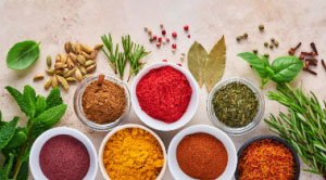 Different ground spices spread out on a flat surface
