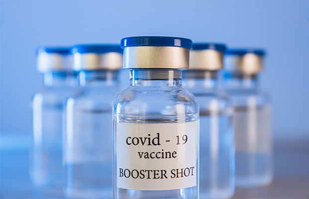 Close up of vials with a label saying "Covid-19 vaccine".