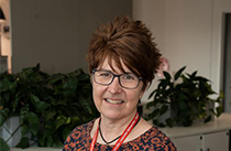 Headshot of Shona Holding in an office.