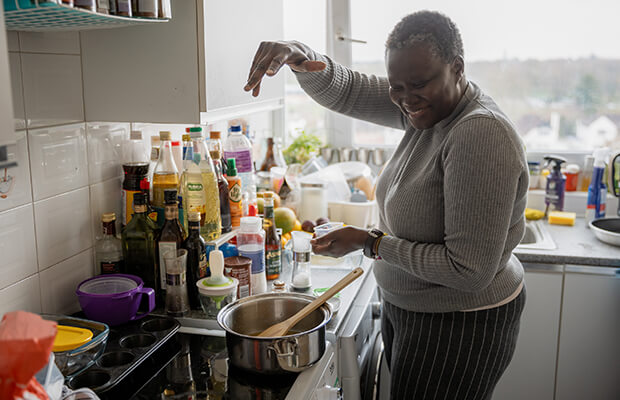 Alice Odeke cooks in her kitchen