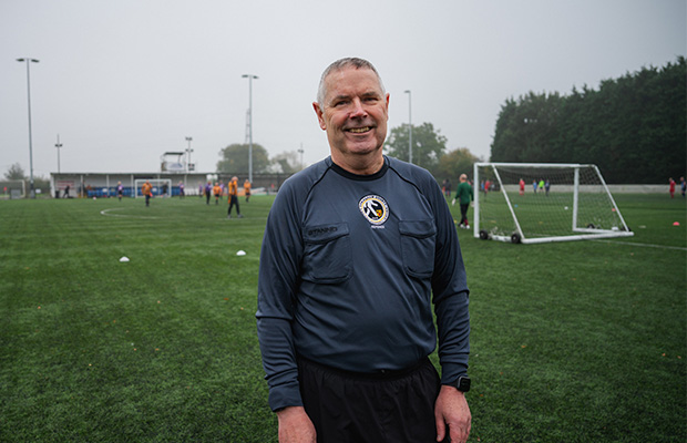 Kevin McGovern-Ims standing on a football pitch 