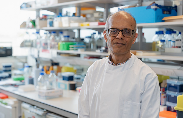 Professor Ajay Shah standing in a lab.