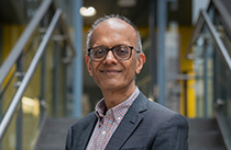 Headshot of Professor Ajay Shah in an office.