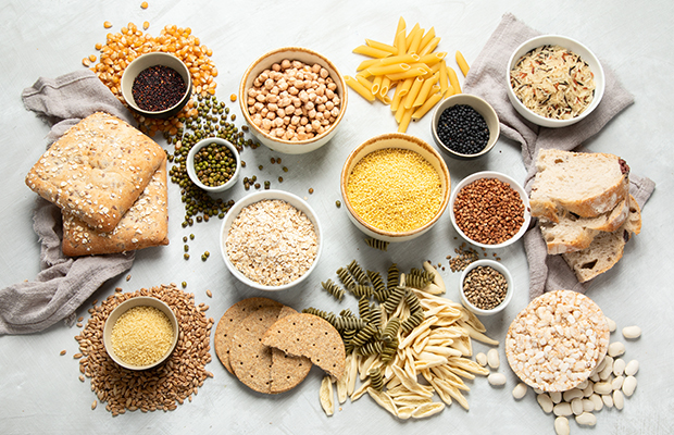 Selection of carbs including pulses, pasta and bread.