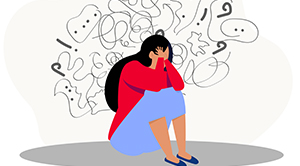 Illustration of a person crouched over on the floor with their head in their hands with scribblings around their head suggesting negative mental thoughts. 