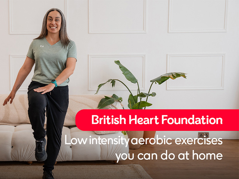 Hara performing a knee raise with a hand tap with the text "Low intensity aerobic exercises you can do at home"