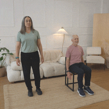 Hara and Peter performing a knee raise with a hand tap.