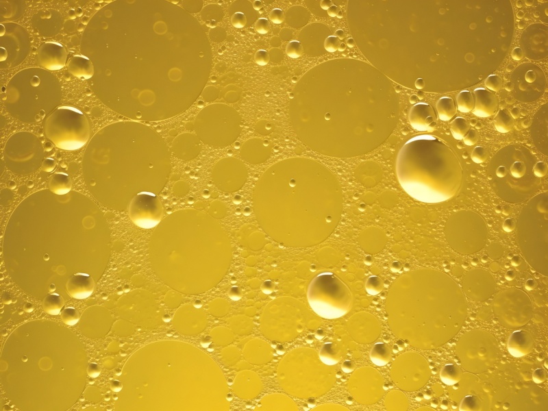 A close up of bubbles in fatty oil.