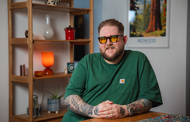 James Hall sat at a table in his home.