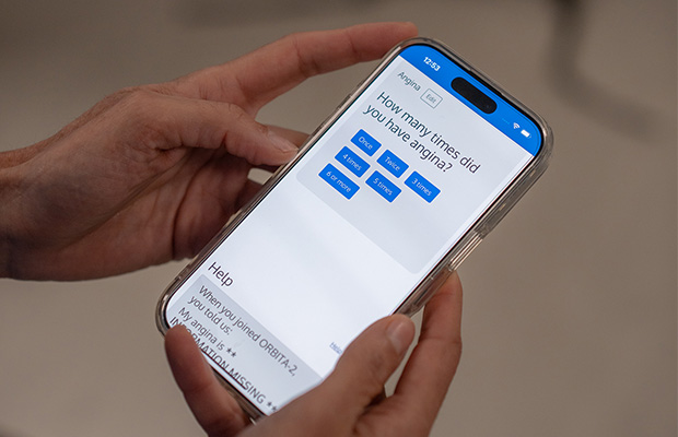 A phone showing a digital questionnaire from the ORBITA-2 trial which aims to improve angina treatment.