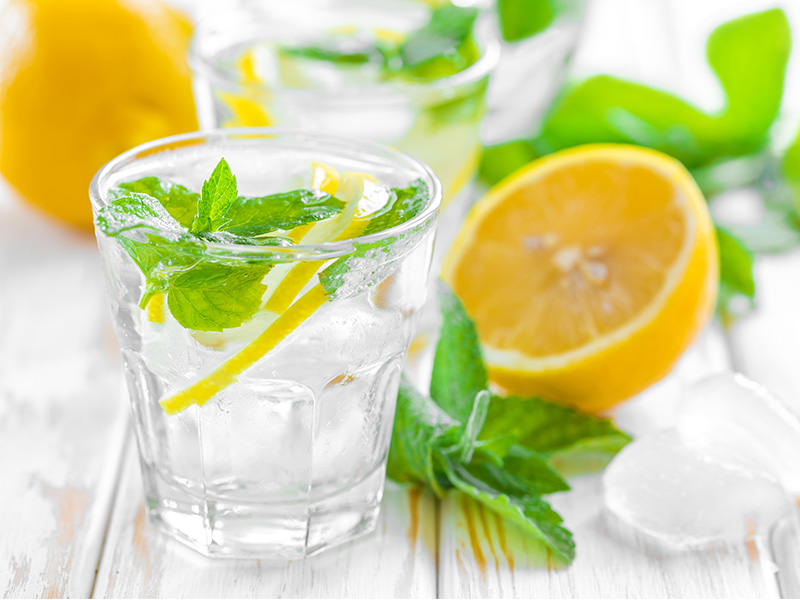 Glass of water with ice and lemon
