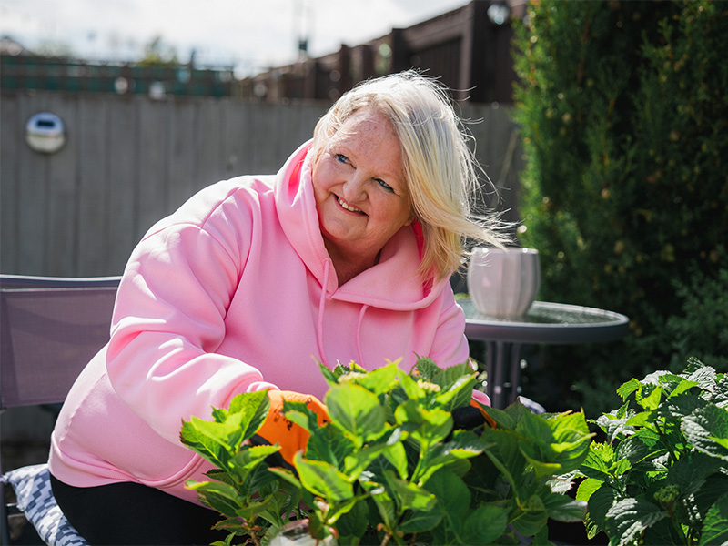 Bernadette gardening.