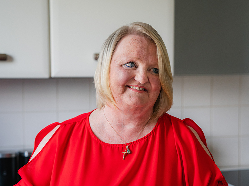 Bernadette Williams standing in her kitchen.