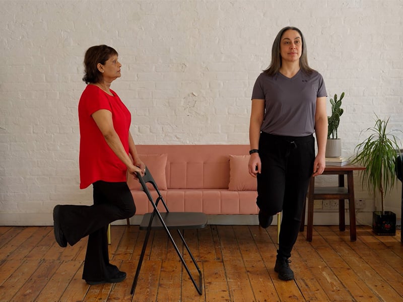 Corinne and Hara demonstrating a single leg stance.