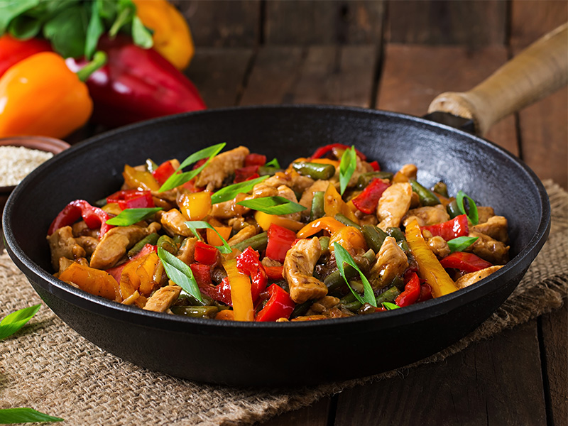 A stir fry in a wok.