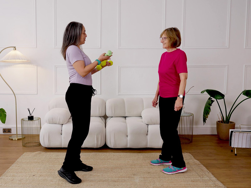 Hara Markos and Nicola Hirschle holding weights for compound exercises.