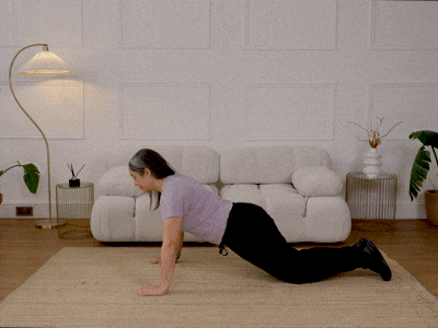 Hara performing a kneeling press up.