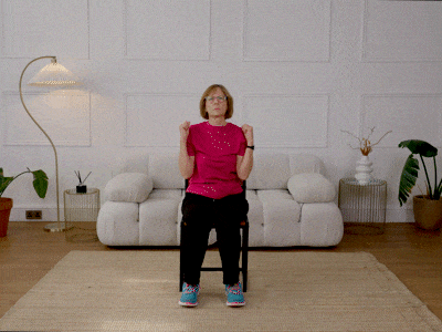 Nicola performing a seated shoulder press.