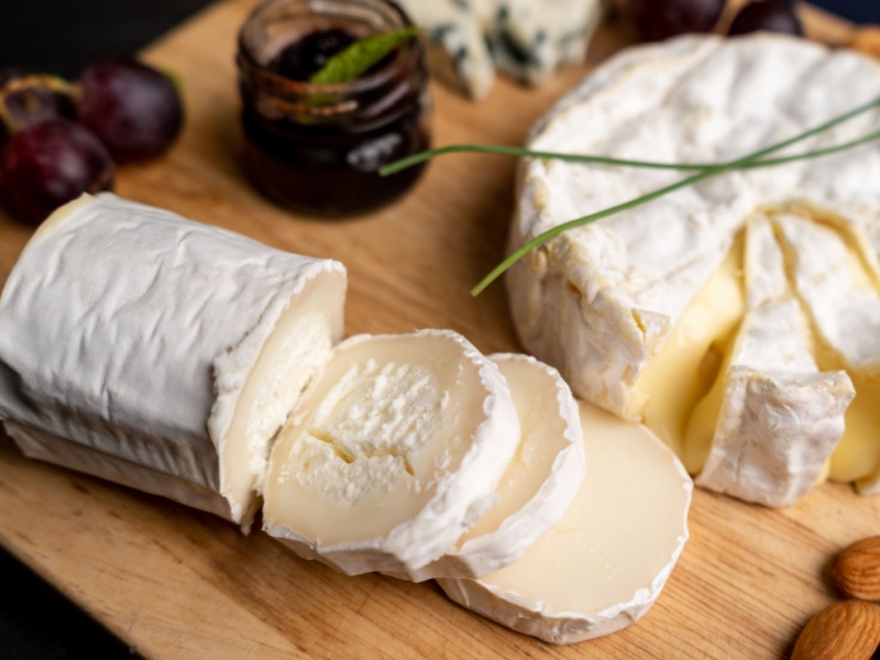 Goat's cheese on a wooden board.