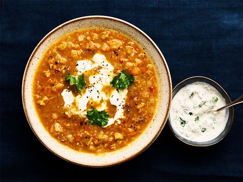 Curried lentil soup with yogurt drizzle.