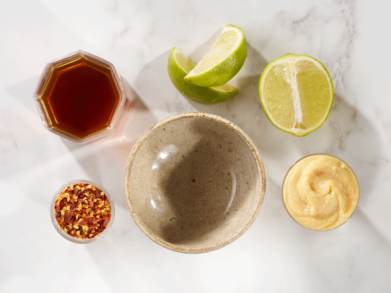 Spicy miso and lime sauce being made step by step.