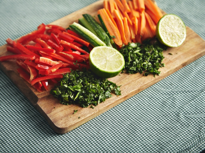Vegetables spread out on a wooden chopping board