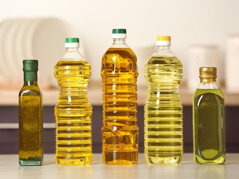 A row of bottles of different types of seed oils.