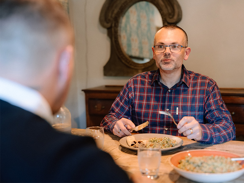 Ben eating a healthy meal with his husband, David.