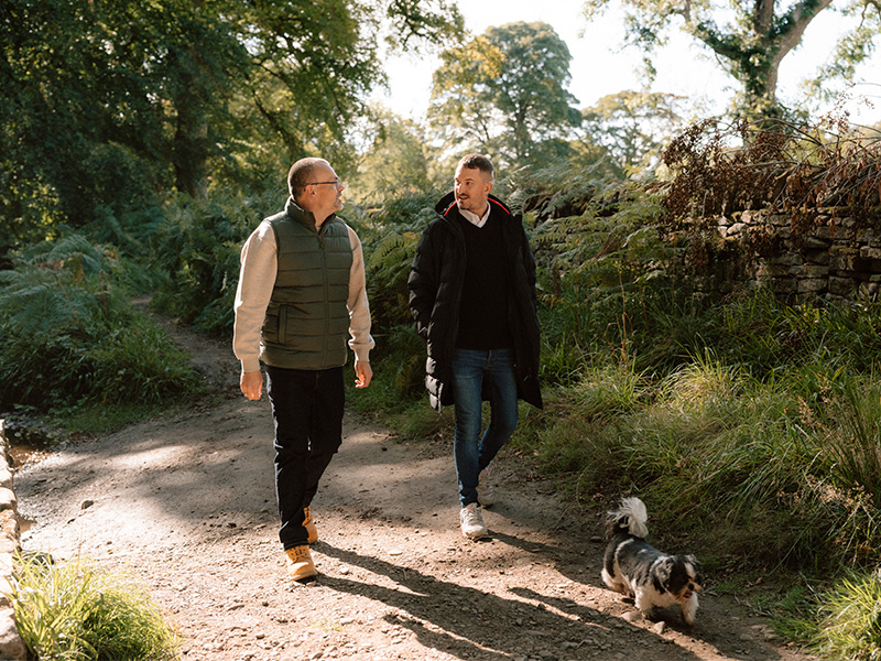 Ben walking outside with his husband, David.