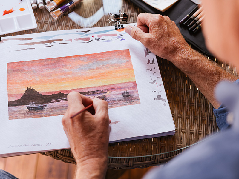 Nigel painting with watercolours.