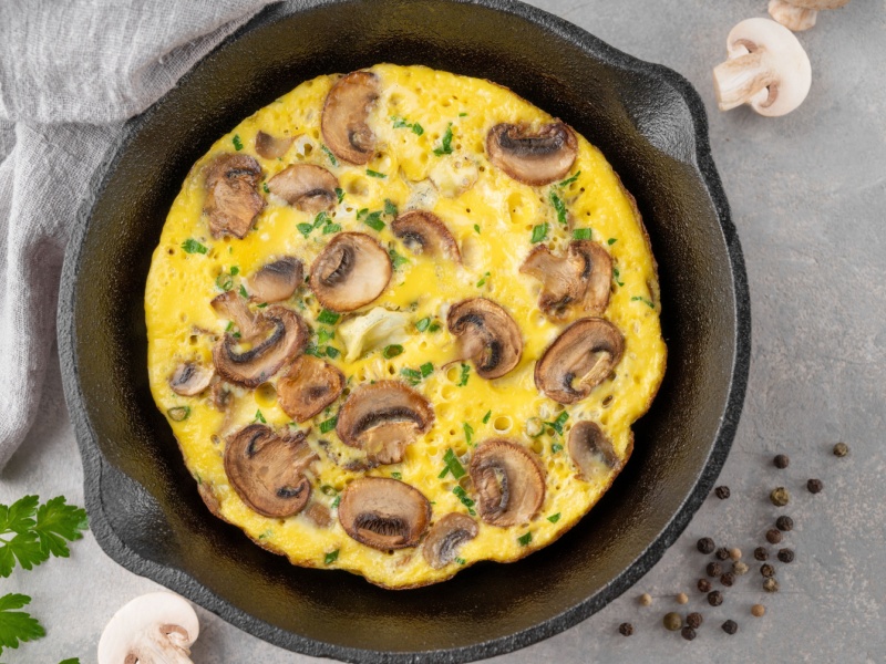 A mushroom omelette in a pan.