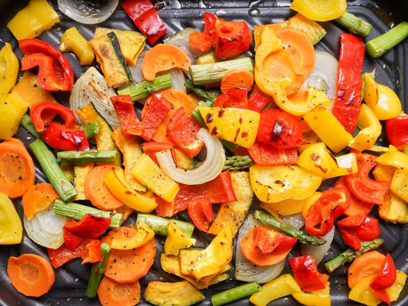 Roasted vegetables in a pan.