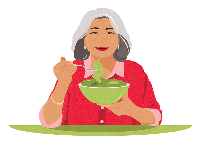 A person eating fresh salad