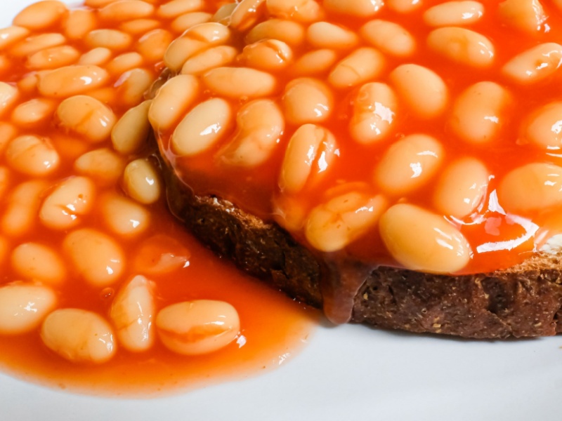 Baked beans on toast on a plate.