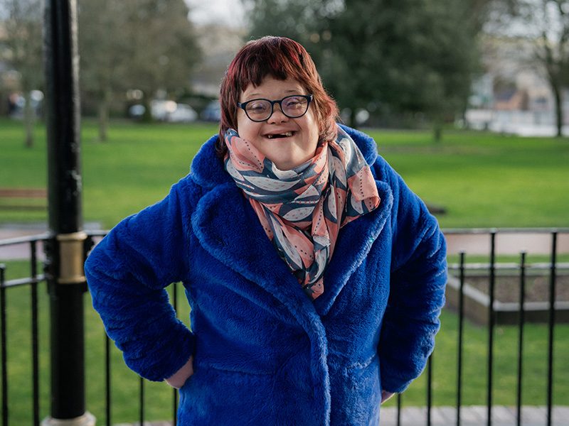 Sara standing in a gazebo in a park.