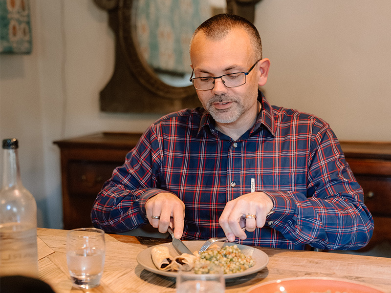 Ben eating a healthy meal inside.